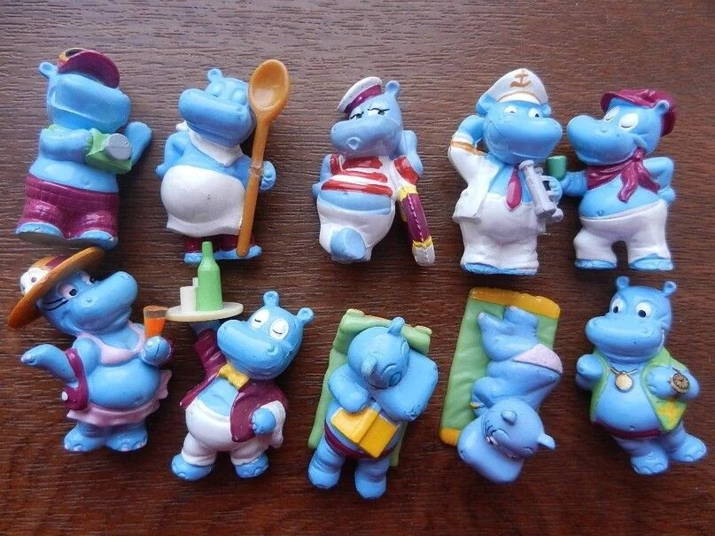Reference of small collectable casual game props styled like Kinder Surprise miniatures with chunky rounded forms